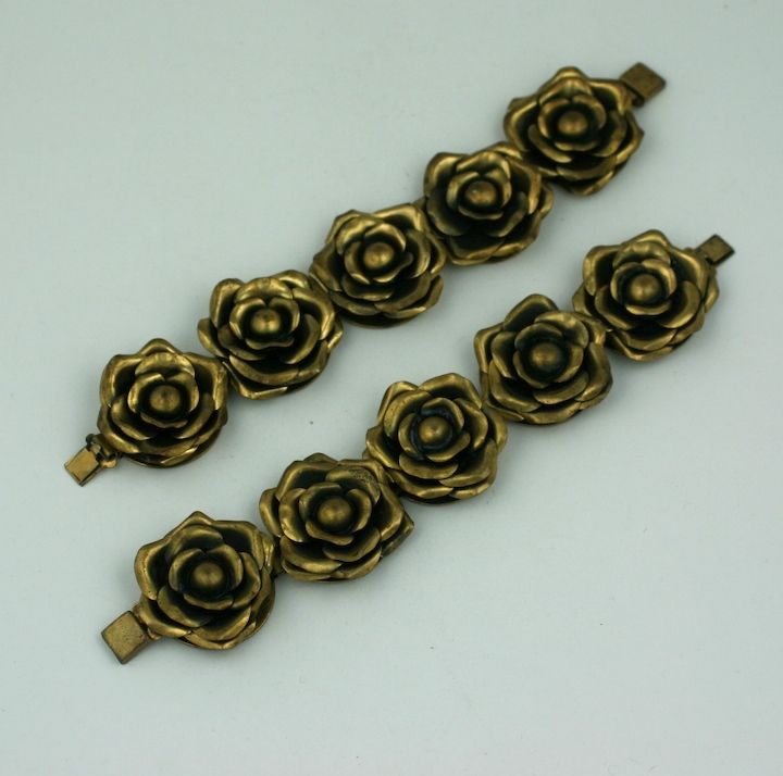 Charming pair of 3 dimensional brass rose bracelets from the late 30's. Each link contains a large flowerhead. Green gold finish. Excellent condition.
7 x 1.5