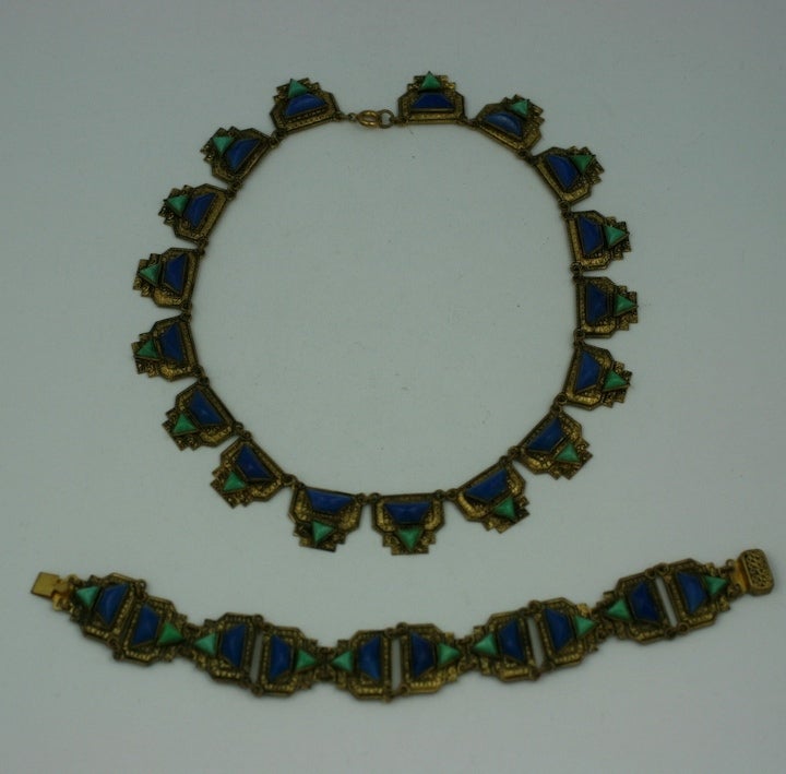 Attractive necklace and bracelet combination from Czechoslovakia circa 1930s. Glass stones in lapis and amzonite in deco shapes are set within gilt etched brass settings.<br />
Necklace 15