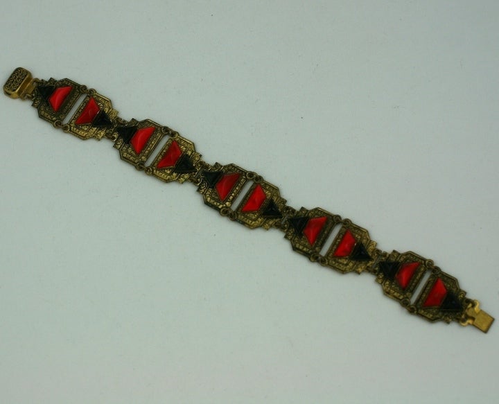 High style deco bracelet of red and black cut glass stones on ornately engraved links.
Czech 1930s.  Excellent condition.