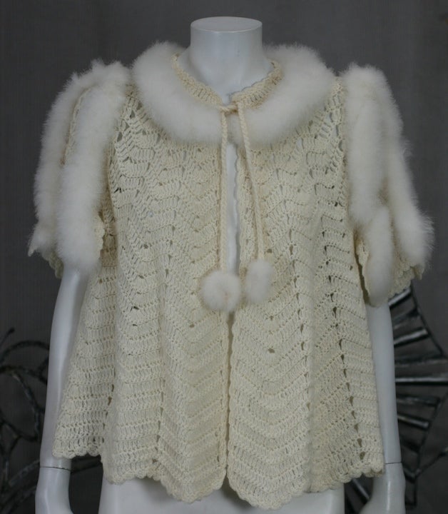 Charming hand crochet wool bed jacket form the 1930s. Unusual eiderdown trim and accents.
Excellent condition.
