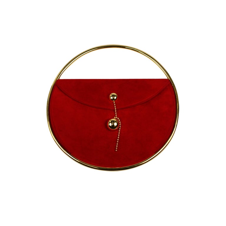 Red suede handbag An Escada Red Suede and Silk Handbag, with goldtone hardware, a suede and double goldtone chain shoulder strap, an exposed top zip closure and two interior pockets. Together with a dust bag. Together with a dust bag.