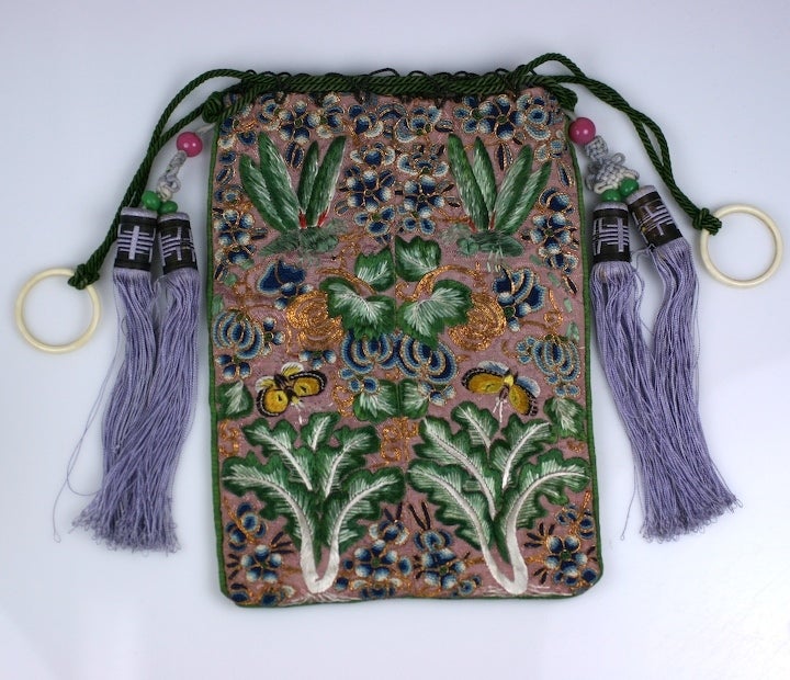 Made for the western market circa 1900,of fine and unusual embroidery of yellow  butterflies,canton blue cherry blossoms , and green leafy bok choy.The reverse embroidered with blue gardinia, and yellow butterflies.mauve silk tassles and peking