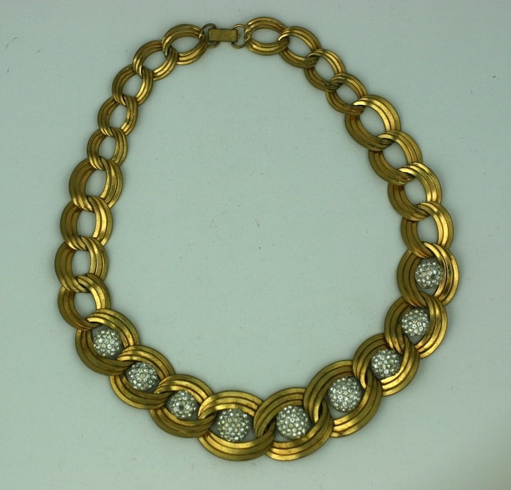 Unusual deco necklace of tripled graduated links with pave rhinestone half domes for accent. Striking necklace combination from the late 1930's. USA 1930's. Excellent condition.