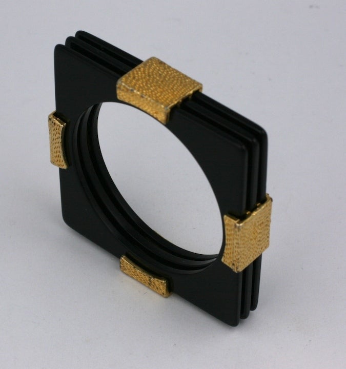 Unusual triple stacked square bakelite bracelet with gilt mounts which hold them together from the 1980s, USA. 
3.25