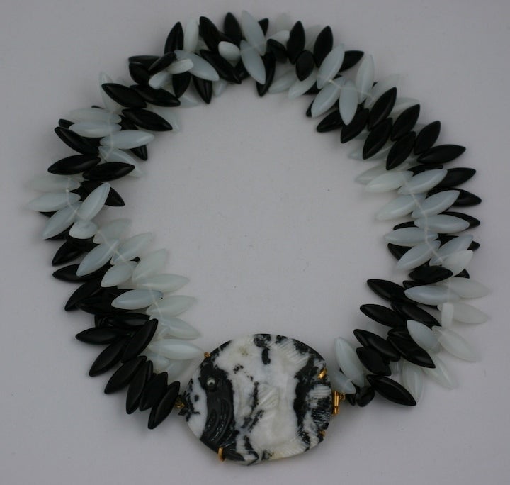 Imposing necklace of black and white chalcedony spoke beads with a hand carved zebra agate angelfish clasp by Mark Walsh Leslie Chin. Made in France. 20