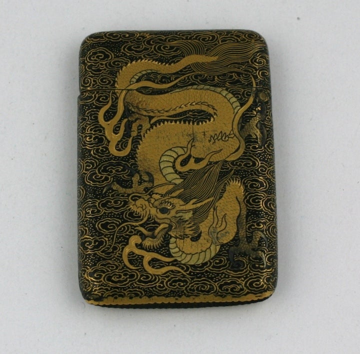 Unusual and exceptional late 19th Century japanese matchsafe with komai work of a dragon in clouds. Decorated on both sides. Exceptional quality with gold and silver designs inlaid into iron base. 1880's Japan. 2.25