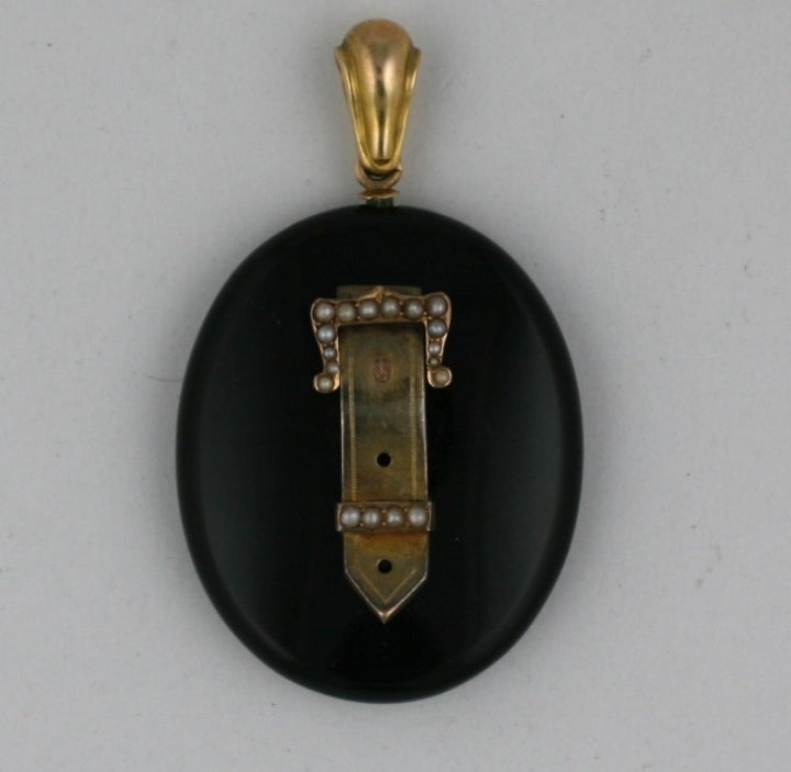Victorian onyx, gold and seed pearl locket pendant circa 1880's. Lovely buckle motif with photo compartment in back. USA 1880's. 2.25