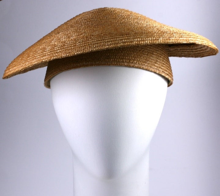 Sonia Rykiel's Parisian version of a straw coolie hat, meant to be worn with her stylish knits. Made for her by French milliner Jean Charles Brosseau of a straw disc atop an interior straw cap. Paris,1980s. 
Exterior 14