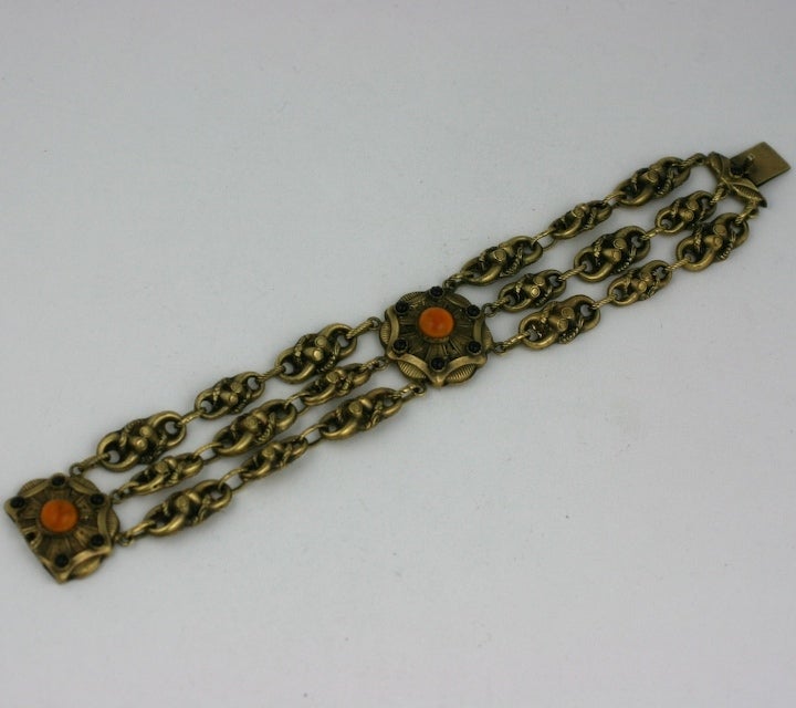 French gilt repousse link bracelet with faux topaz and faux jet cabochons. Antique green gold finish. Circa 1930 France.
Excellent condition.