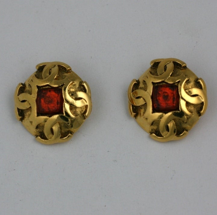 Attractive Chanel logo earrings with deep citrine poured glass stone. Clip back fittings. France 1980's.  1.25