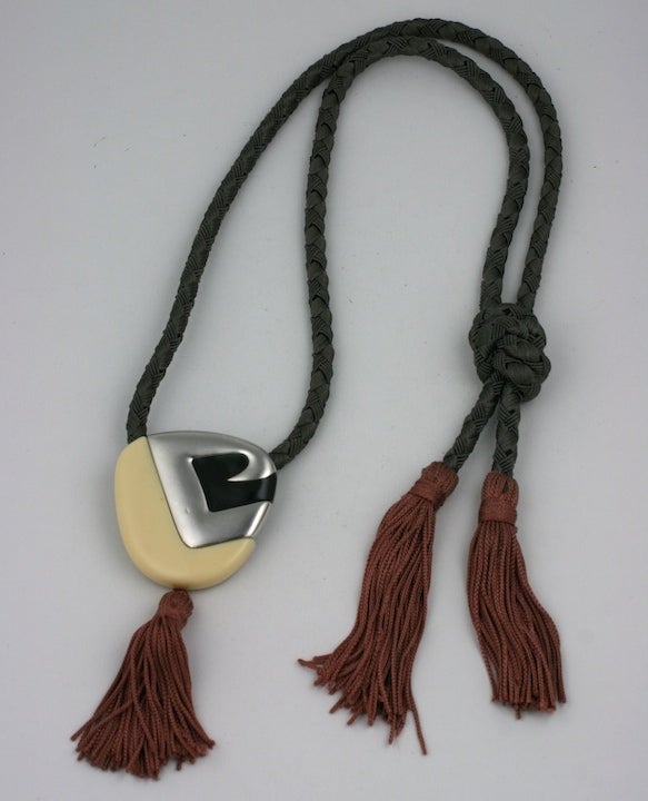 Unusual deco inspired tassel pendant from a 1970's point of view. Bakelite, metal and silk. Monet 1970's.  2