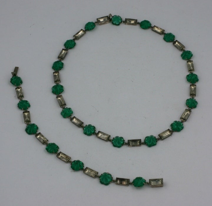 Lovely art deco paste suite from the 1930's. Fluted faux emerald cabochons alternating with clear paste baguettes. Suite entirely set in sterling. USA 1930's . bracelet 7