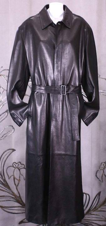 Incredibly chic and elegant black leather men's trench by Jil Sander. Supple black calf perfectly cut and proportioned for  amazing effect with slightly military overtones.
 Cut almost floor length with covered button placket down front and cuffs
