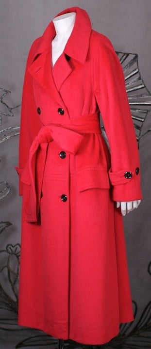 Attractive cashmere double breasted coat in vibrant cherry red. Beautifully tailored and fully lined. Welt seam detail at hip with pockets. 1980s USA.
Excellent condition.
