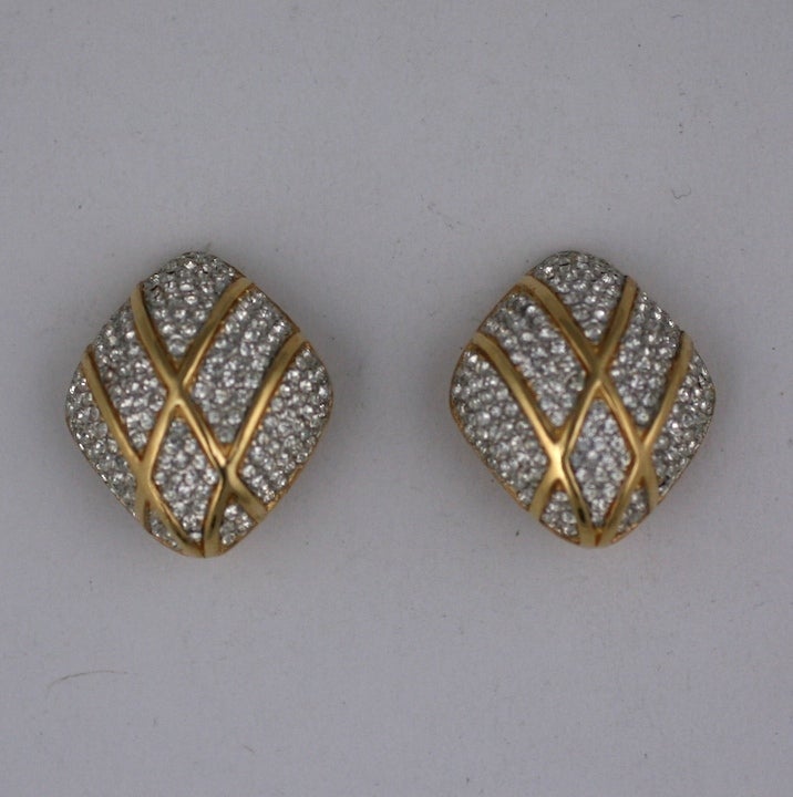 Attractive pave earclips by Ciner, NY with gold cross hatched motifs on a pave background. 1 1/4