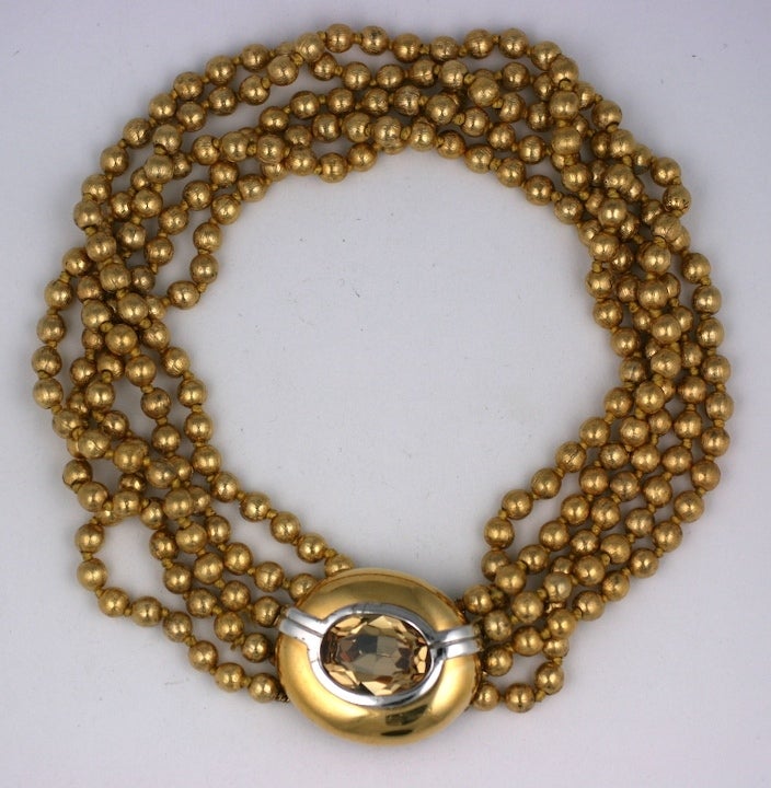 Striking Ciner multistrand gold metal bead necklace with large 2 tone clasp with large citrine colored stone. Clasp 1.75