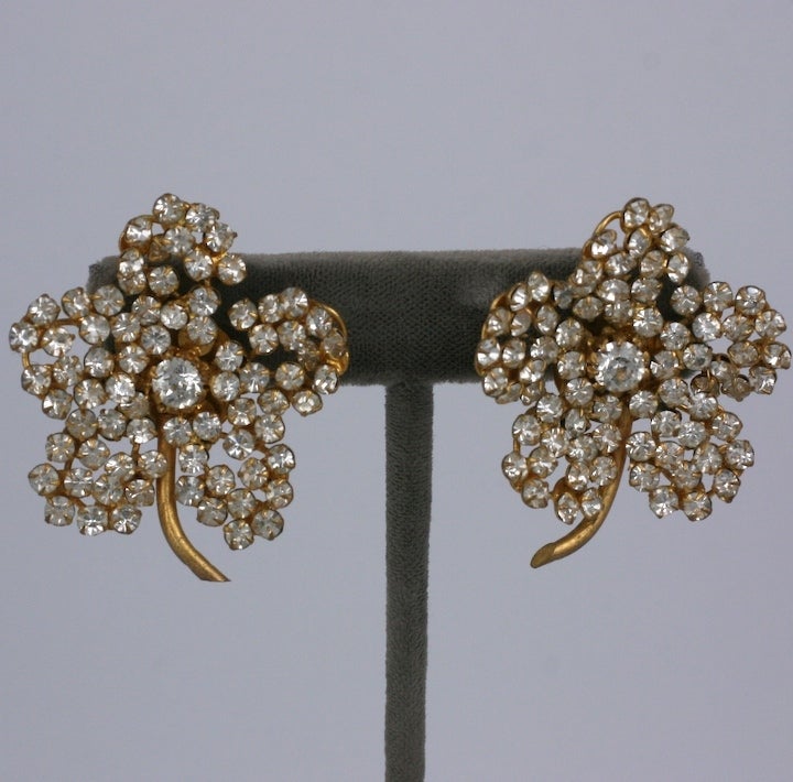 Hand set pastes form these floriform earrings made in France circa 1950's. Ex collection of D.D. Ryan, fashion icon.
1.5