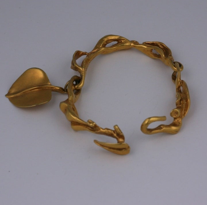 Artistic modernist leaf motif bracelet with leaf fob hook closure at side closes with leaf.  2.5