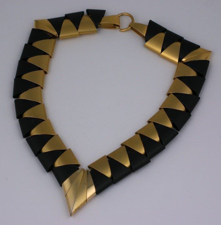 Cool and unusual necklace from the 1980s composed of gunmetal and gilt triangular 