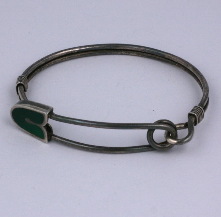 Cool sterling safety pin motif bracelet with deep green enamel from 1970s Italy. Interesting construction suitable for men or women. Can be high polished to silver or left darkened as found. 2.25
