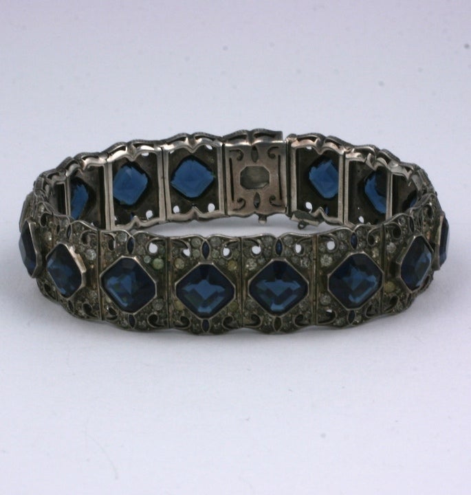 Art Deco paste bracelet with square faux sapphires with pastes. Tiny marquises shaped sapphire stones edge the sides of each square stone. 1930s France. 7