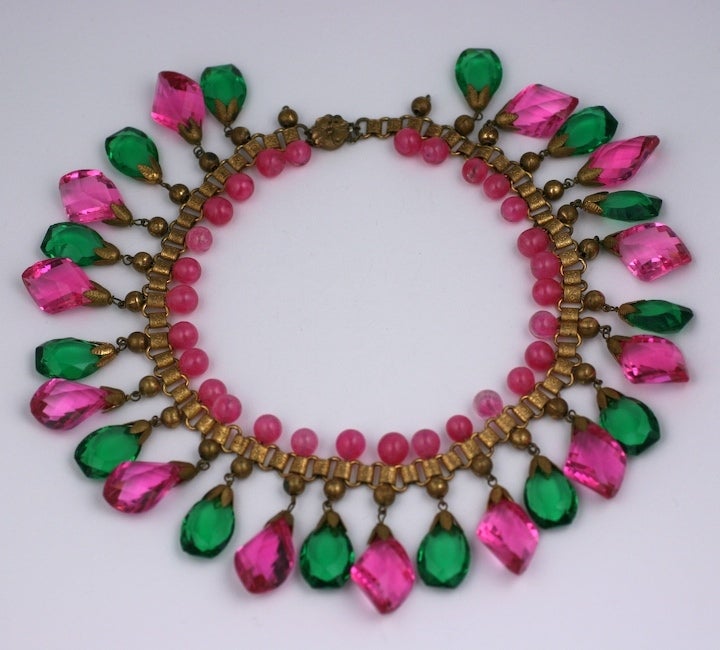 Unusual Czech gilt book chain necklace of rose pate de verre beads with faceted fushia and emerald crystals. Unusual twist cut on the fuschia crystals. Czech 1930's.
Excellent condition.
16