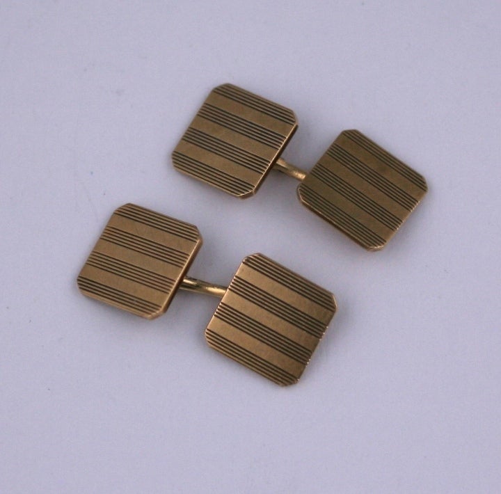 Clean lined Art Deco era cufflnks in 14K by Tiffany and Co. 4 etched stripes are repeated in a cut corner square form. .5