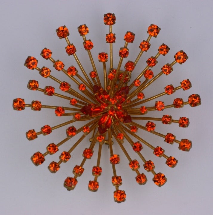 Unusual and massive French starburst fur clip, each spike hand set with graduated orange crystals. The center flowerhead is set with marquise and round graduated orange crystals. Dimensional and striking. 4 1/8