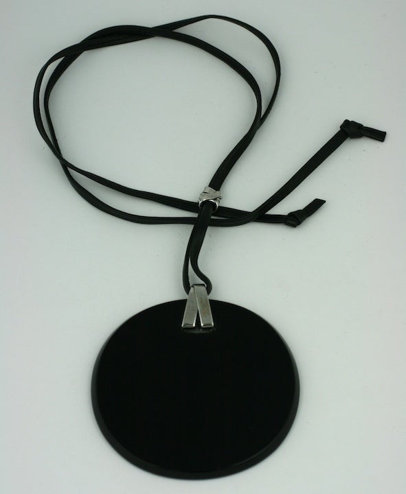 YSL's oversized disc pendant of polished onyx with 