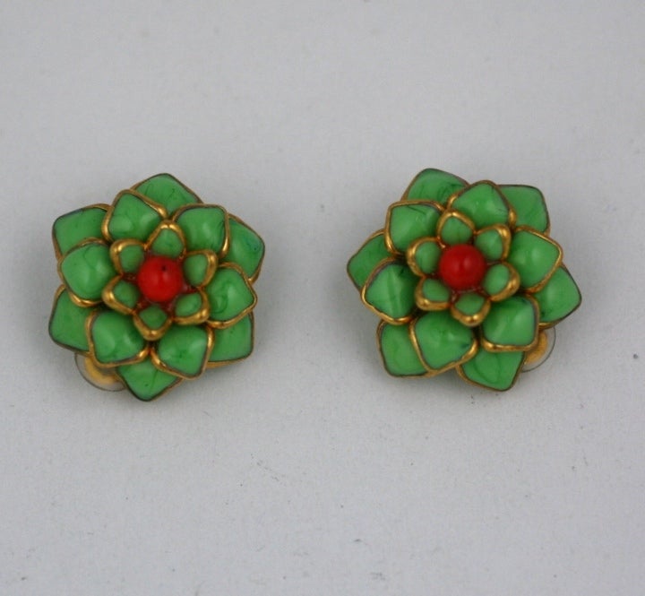 Handmade poured glass Zinnia earclips made in the French studios of Mark Walsh Leslie Chin. Opaque Lime glass set within gilt metal surrounds. Deep coral glass bead center. 1.25