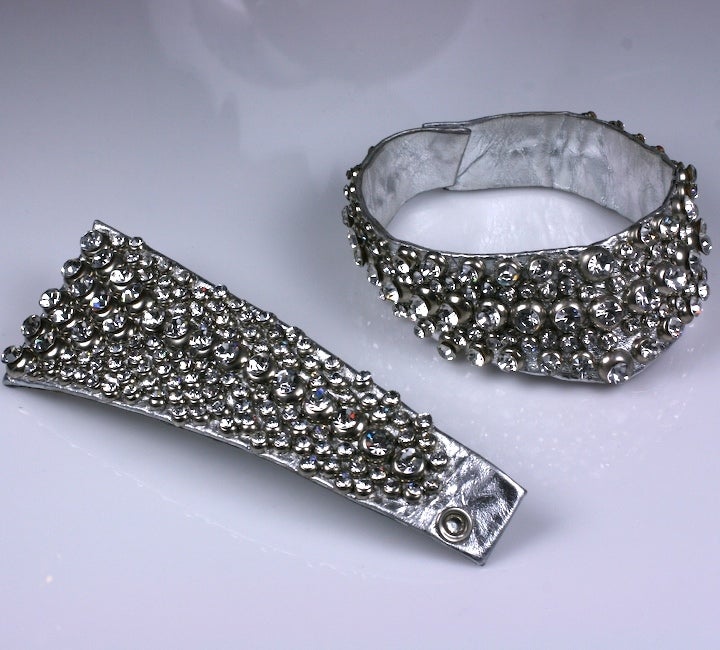 Suite of silver leather and metal casings studded with lots of sparkly Swarovski rhinestones. A slightly 