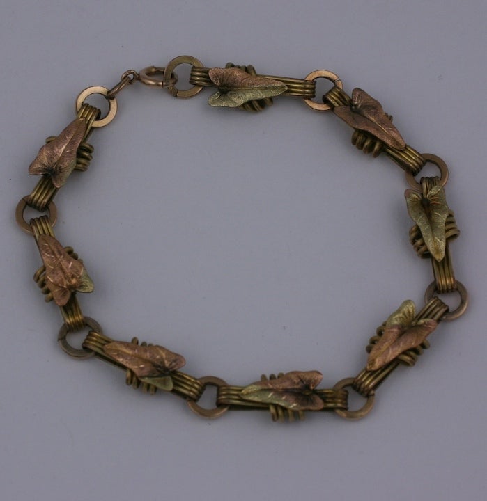 Attractive tricolored gold filled leaf bracelet from the late 19th Century. Leaves and links are rendered in tones of pink, green and yellow gold. Large size (8.5