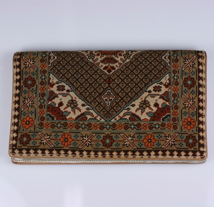 Attractive handworked needlepoint clutch patterned as an antique rug. Satin lined. USA 1950's. 5