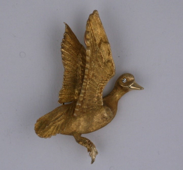 Realistic clip-brooch of a duck in flight from the 1960's set with diamond eyes. Heavy 14K gold casting, beautiful finishing and quality. 1960s USA.
1.75