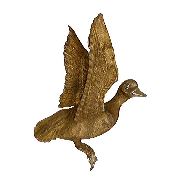 Gold and Diamond Duck in Flight