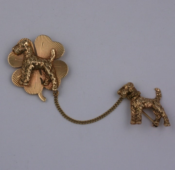 2 terriers and a clover...triply lucky for the dog lover rendered entirely in 14K gold. 2 brooches connected with a gold 