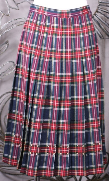 Vintage wool pleated kilt decorated with bezel set Swarovski crystals along the hem. Wool pleated differently on back for color variation. Side zip closure.
Upcycled and made for a Japan Vogue Shoot x MWLC studios. 
28