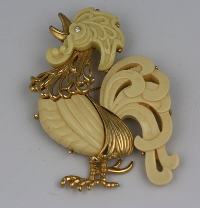 Large rooster brooch by Hattie Carnegie of gilt metal and carved bakelite made to resemble imitation ivory. 1960's USA. 3.5