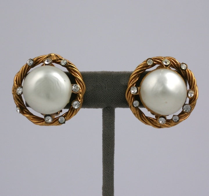 Large faux pearls by Gripoix are set in twisted gold surrounds and accented with Swarovski crystals for Chanel, Paris.
1980s France. Excellent condition.  
1.25