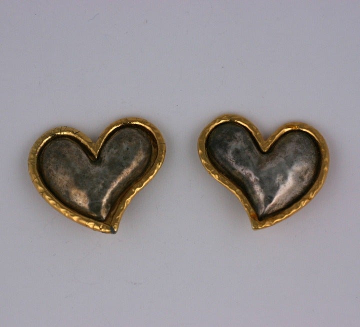 Massive Heart Earrings by Edouard Rambaud of hammered silvered metal with gilded border. France 1980's. Clip back fittings. 1.75 x 1.5