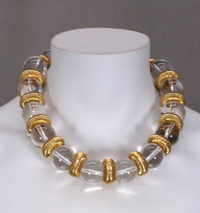 Graduated lucite beads with fluted gilt spacers form this attractive K.J.L. necklace. 1980's USA. Excellent condition.
17.5