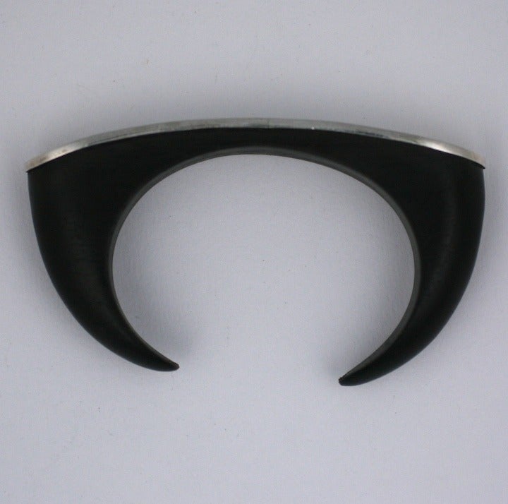 Attractive and oversized cuff of ebony with  a sterling face. Unusual and unique in scale. Top 4