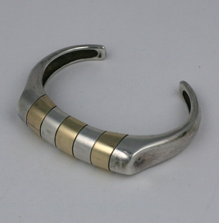 Sterling bangle with 14k gold stripe inlays. Clean and modern looking. Signed: Ninas. SS and 14K . Small size.  1.25