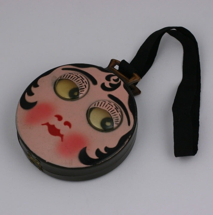 Charming Art Deco Flapper dance purse with moveable googly eyes. Airbrushed celluloid with silk grosgrain handle with velvet compartments and makeup mirror.  3.5