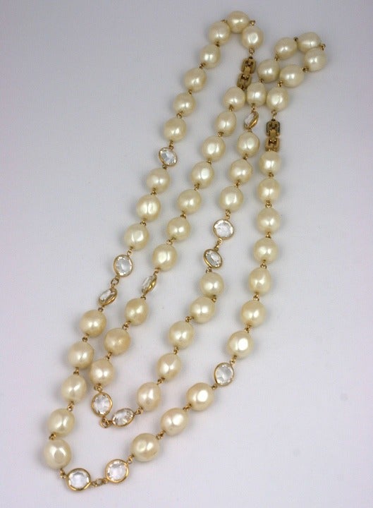 Pair of versatile Givenchy faux pearl and crystal necklaces. Can be worn layered or as one long necklace. 24
