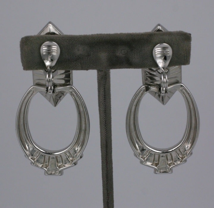 Silvertone  jeweled earrings from Yves Saint Laurent with large stone and jewel decorated dangling hoops. Clip back fittings. 2.5