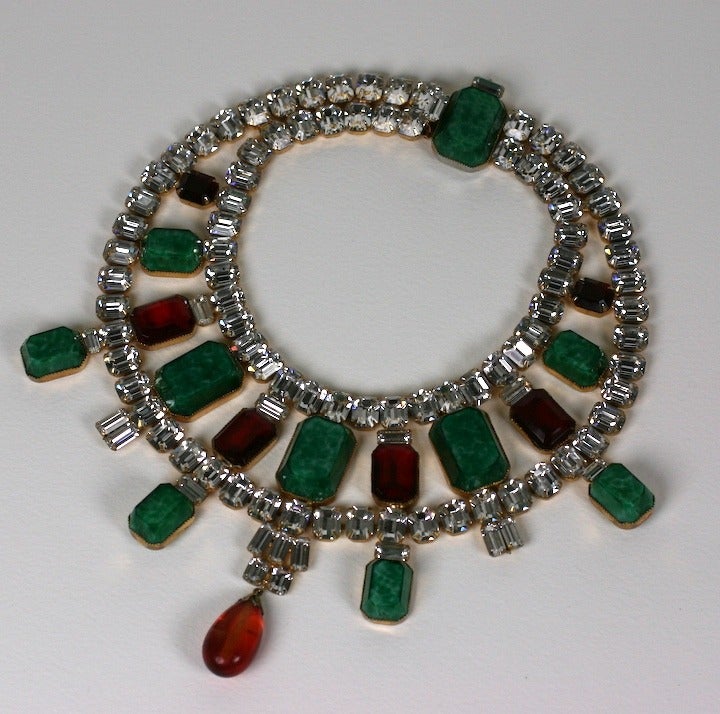 Dramatic oversized Scassi necklace of faux jade and ruby emerald cut stones and Swarovski crystals with a dark citrine drop. Handcrafted. Arnold Scassi. 1960's USA. 
Small Size. Excellent condition.