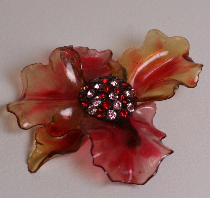 Large patinaed Lucite flower brooch by Vendome with button center set with pink and ruby pastes. 1960's USA. Excellent condition.