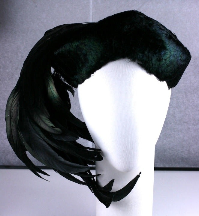 Lilly Dache's striking and extravagant 1930's made to order, iridiscent black Coq plume and feather decorated cocktail hat. Excellent condition.