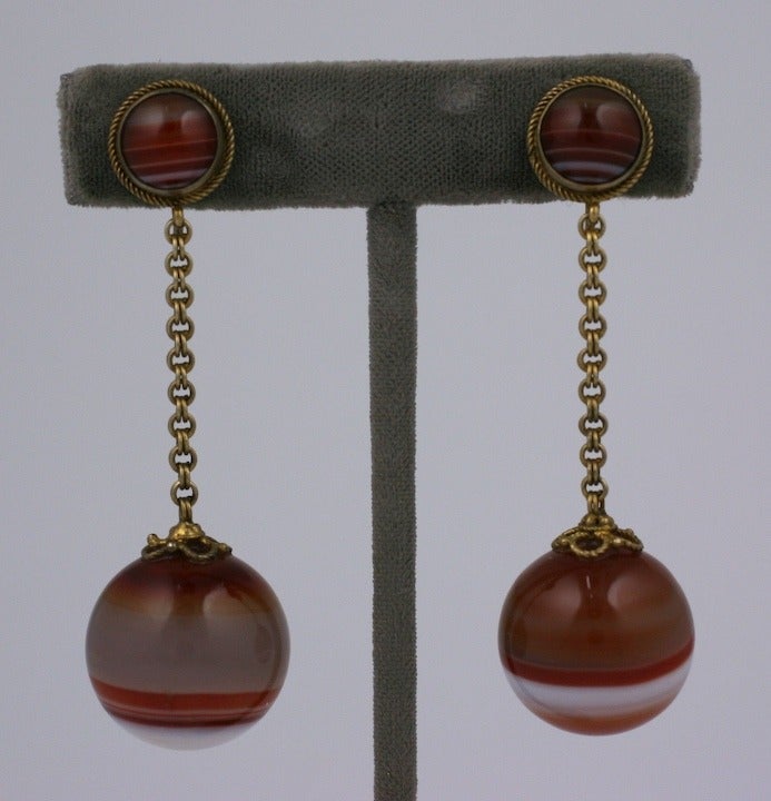 Lovely mid Victorian earrings of Scottish striped agate in a simple drop formation. Timeless elegant design set in gilt metal with a cabochon agate at the ear. The chain is a rich double link which works nicely with the twisted wire borders. Nice